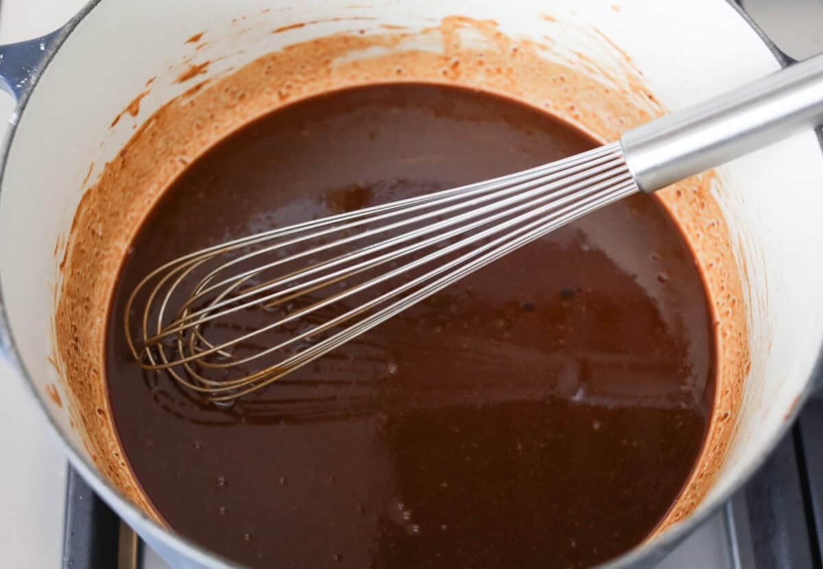 Gumbo is one of those recipes everyone makes differently, but this chicken and sausage gumbo keeps it simple. A dark roux, andouille sausage, and rotisserie chicken give you big flavor with minimal effort. Pot of dark roux and a whisk.