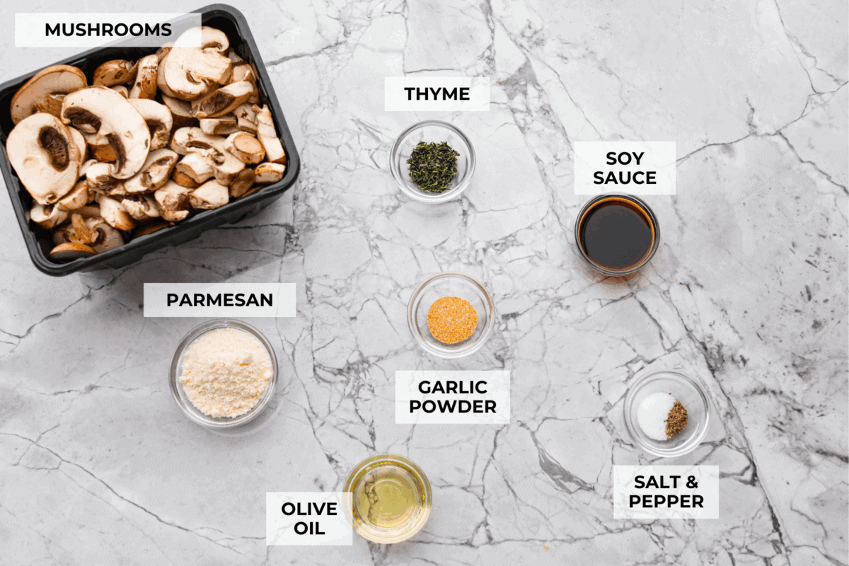 Confession: I never thought I liked mushroomsโฆ until I made these air fryer mushrooms. With garlic parmesan, theyโre juicy, tender, and downright addictive. Even the mushroom skeptics at your table will be fighting over the last bite! Overhead shot of labeled ingredients.