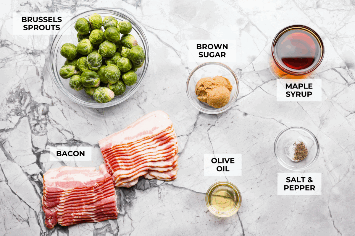 I love bacon. I love Brussels sprouts. Put them together and Iโm sold. But the secret to these bacon-wrapped Brussels sprouts? A drizzle of maple syrup! It makes them sweet, smoky, and completely irresistible. Overhead shot of labeled ingredients.