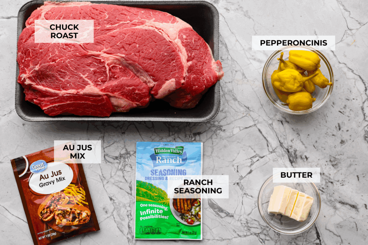 This Mississippi pot roast is melt-in-your-mouth tender, full of rich flavor, and couldnโt be easier. Just five ingredients and your slow cooker does all the work! It's a Sunday favorite at our house, and I know you'll love it too! Overhead shot of labeled ingredients.