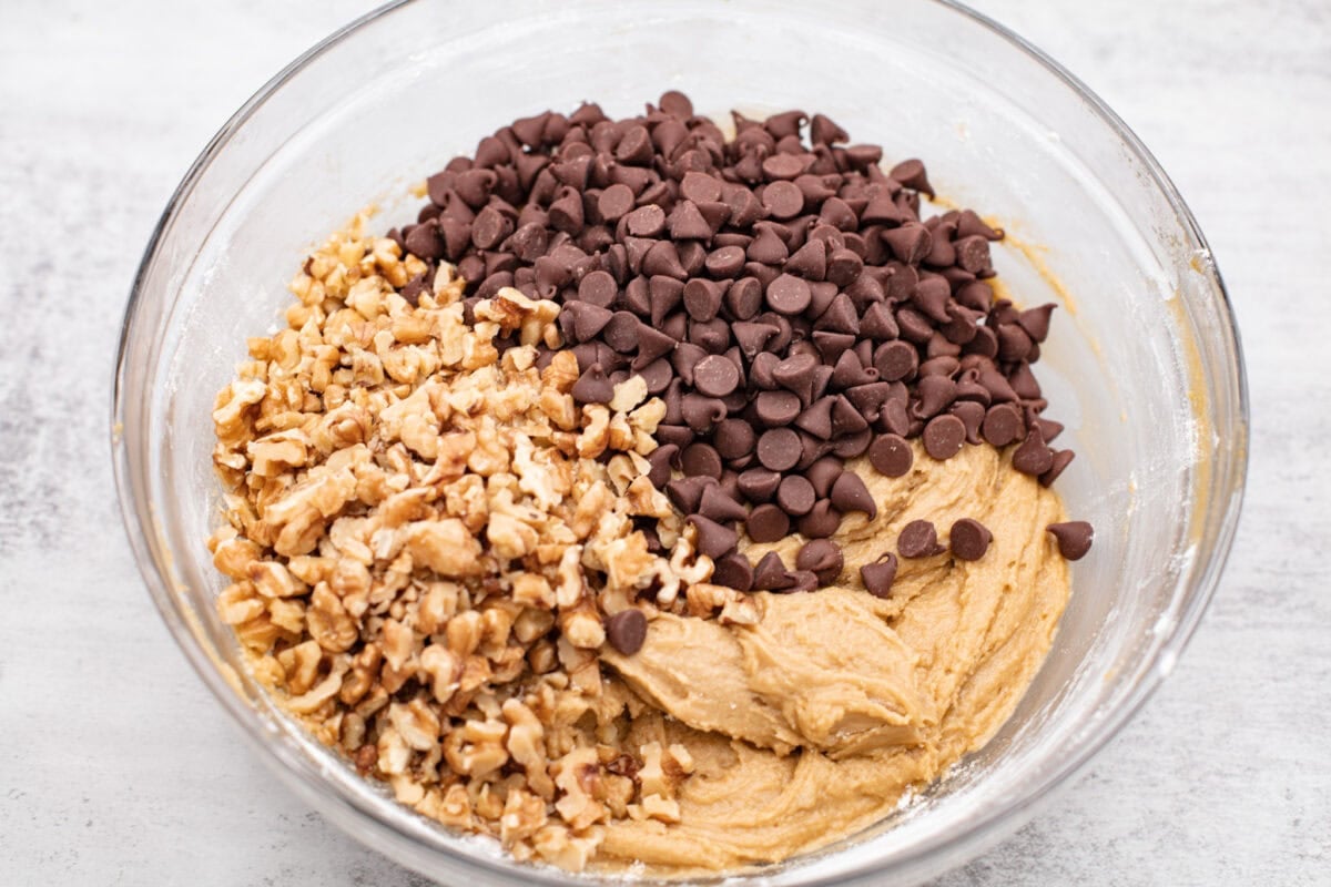 If you’ve never tried a congo bar, they’re basically chocolate chip cookie bars with a little added flair. They’re usually made with chopped nuts or coconut for some extra texture, and let me tell you… They are what dreams are made of. Nuts and chocolate chips added to the combined wet and dry ingredients.