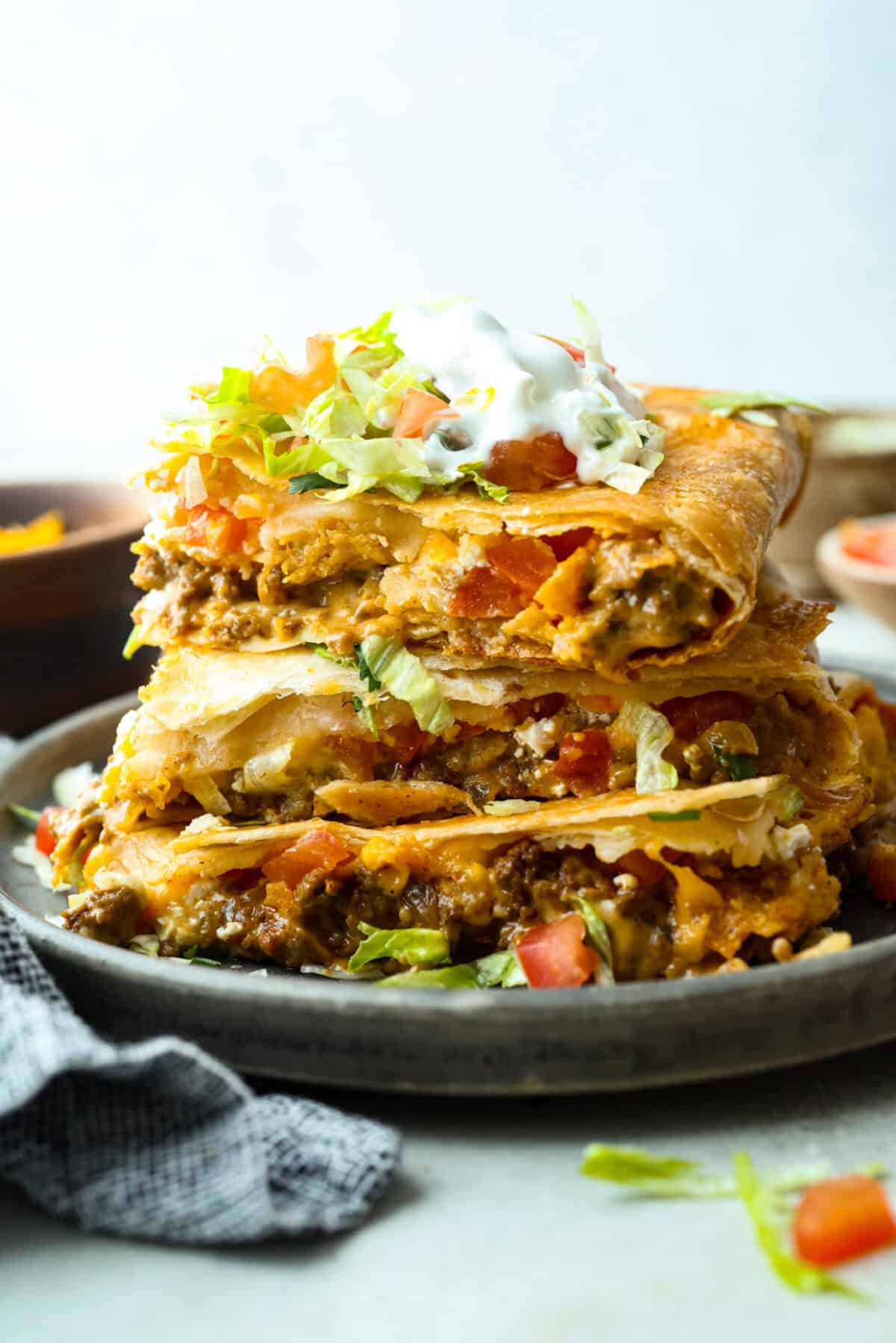 This TikTok-viral Crunchwrap Casserole takes Taco Bell’s iconic Crunchwrap Supreme and flips it into a cheesy, crunchy copycat casserole. It takes everything you love about the Crunchwrap and layers it into one big, family-sized dish! Stacked layers of crunchwrap casserole.
