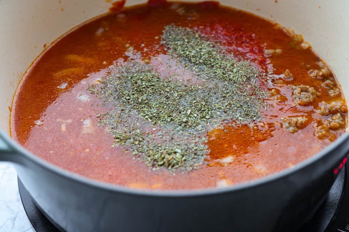 Million Dollar Soup is creamy, comforting, and worth every indulgent bite! The rich tomato soup base is loaded with sausage, cheesy ravioli, and heavy cream. The dollop of ricotta cheese on top is a MUST! Broth, seasoning, and crushed tomatoes added to the meat mixture.