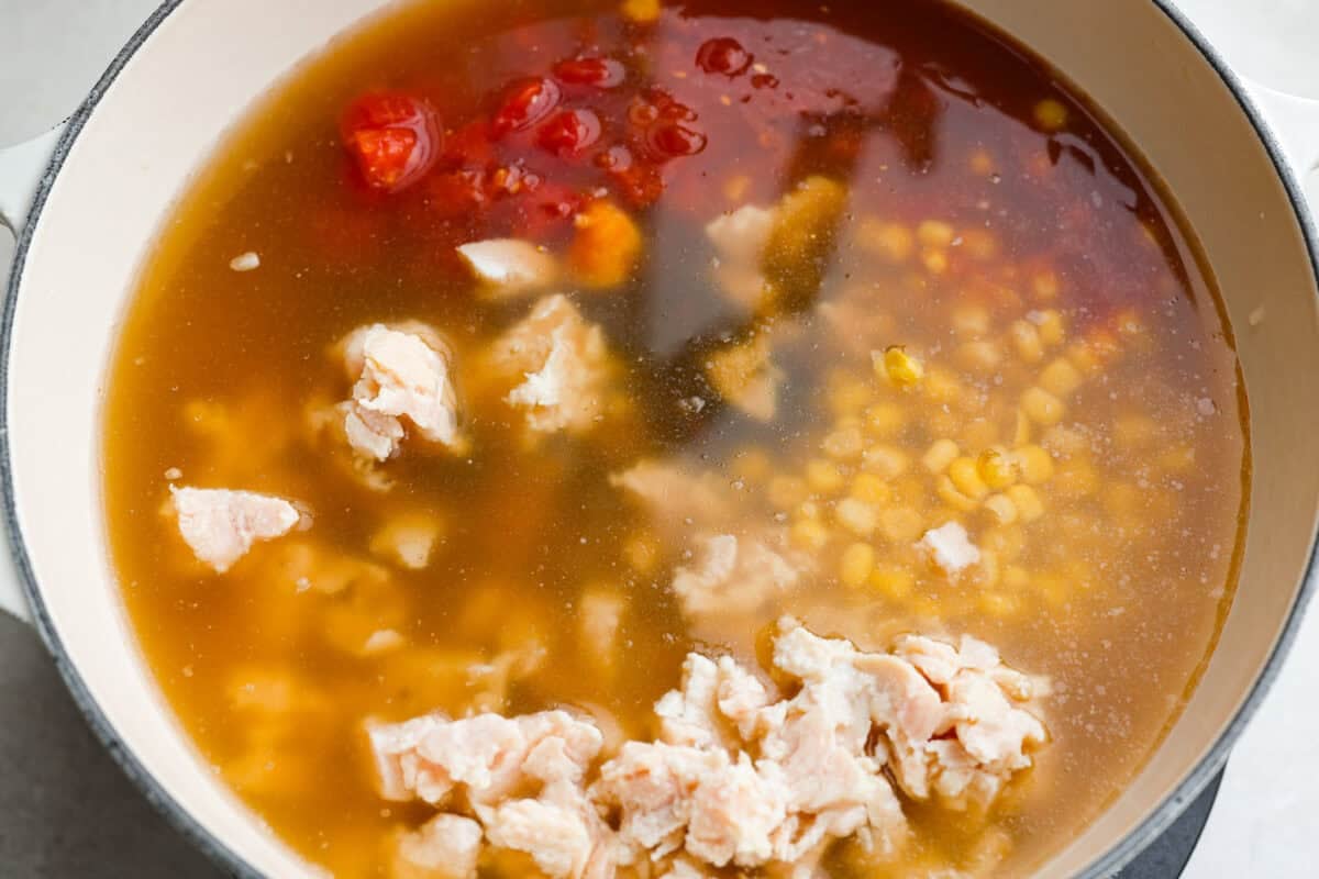 It doesn't get any easier than this 8 Can Chicken Tortilla Soup! Dinner is ready in minutes! Just open, dump, heat, and enjoy bold, delicious flavor in no time! Large pot with all of the canned ingredients dumped in.