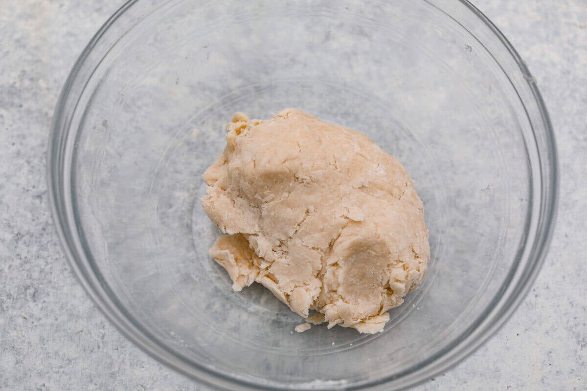 This brown bag apple pie is simple, foolproof, and downright delicious! The secret? It bakes right inside a paper bag, keeping the crust golden, the filling perfectly tender, and your oven mess-free. Water and shortening added to the dry ingredients and mixed together to form a dough.
