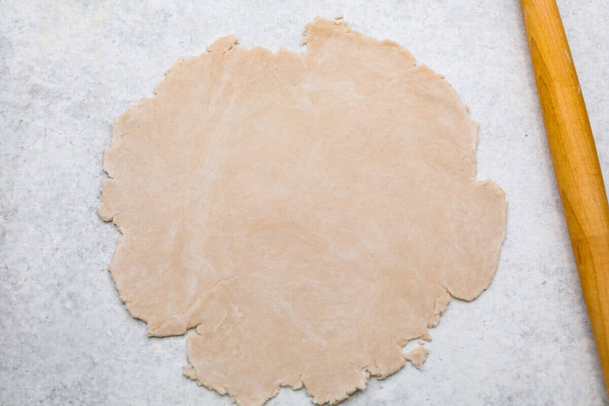 This brown bag apple pie is simple, foolproof, and downright delicious! The secret? It bakes right inside a paper bag, keeping the crust golden, the filling perfectly tender, and your oven mess-free. Dough rolled out into a circle.