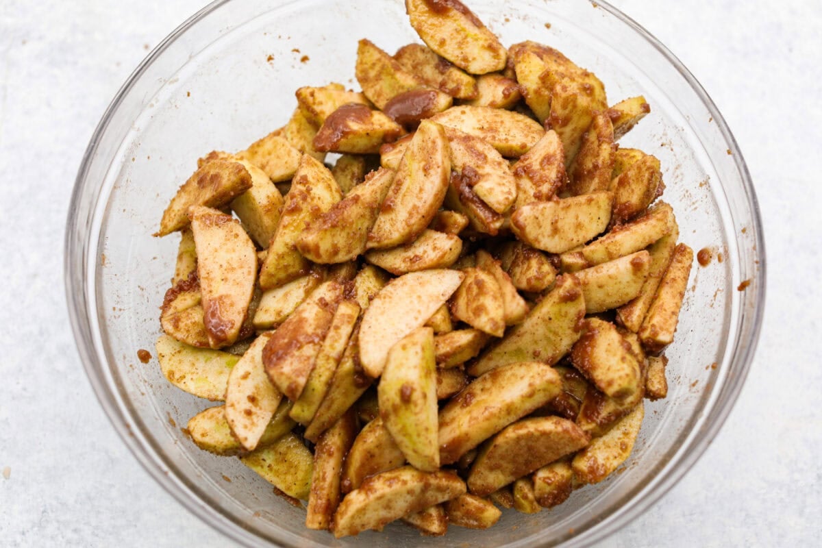 This brown bag apple pie is simple, foolproof, and downright delicious! The secret? It bakes right inside a paper bag, keeping the crust golden, the filling perfectly tender, and your oven mess-free. Sugar mixture and apples mixed together to make the brown bag apple pie filling.
