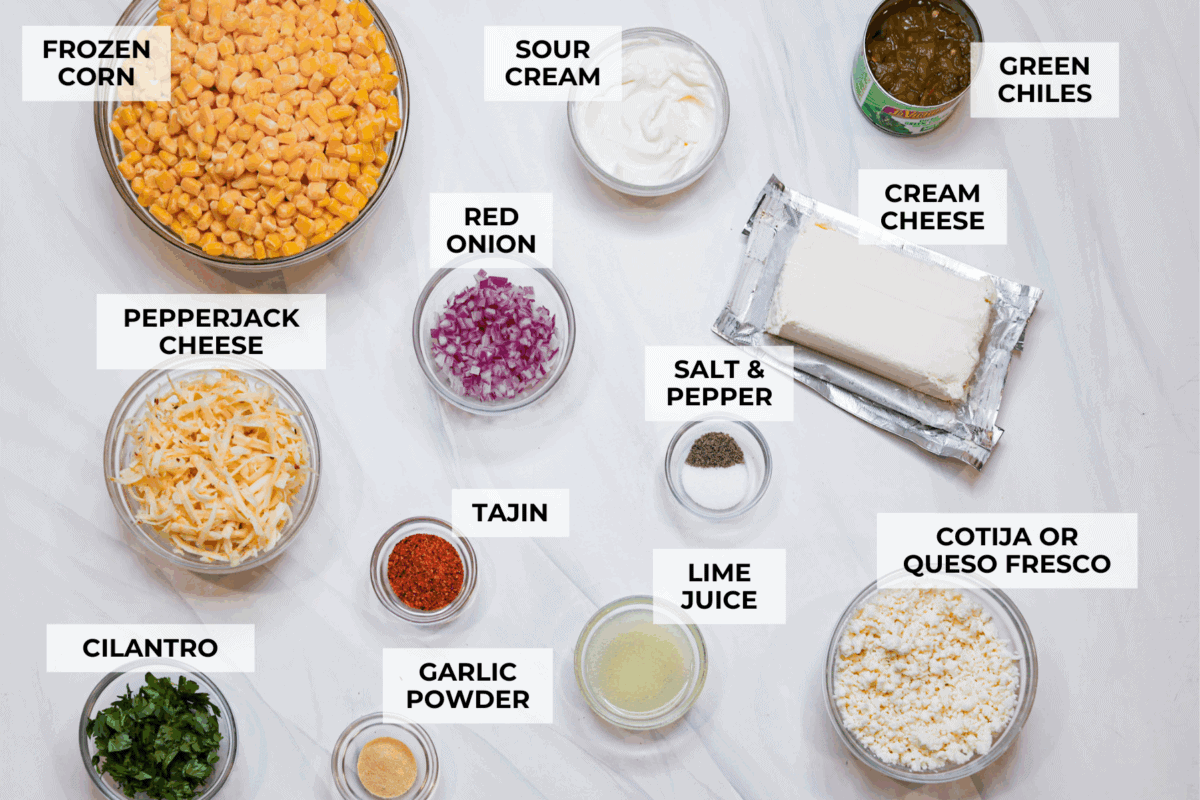 My slow cooker Mexican street corn dip takes all the flavors of elote and turns them into a warm, creamy, cheesy dip. Just toss everything in the crockpot and let it do the work. Overhead shot of labeled slow cooker Mexican street corn dip.