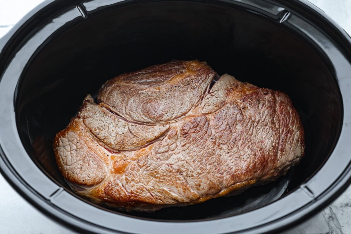 My Slow Cooker Italian Beef is tender, juicy, and loaded with zesty Italian flavor. The secret's in the way you sear the beef! This creates melt-in-your-mouth meat perfect for sandwiches or hearty dinners. Seared beef in the crockpot.