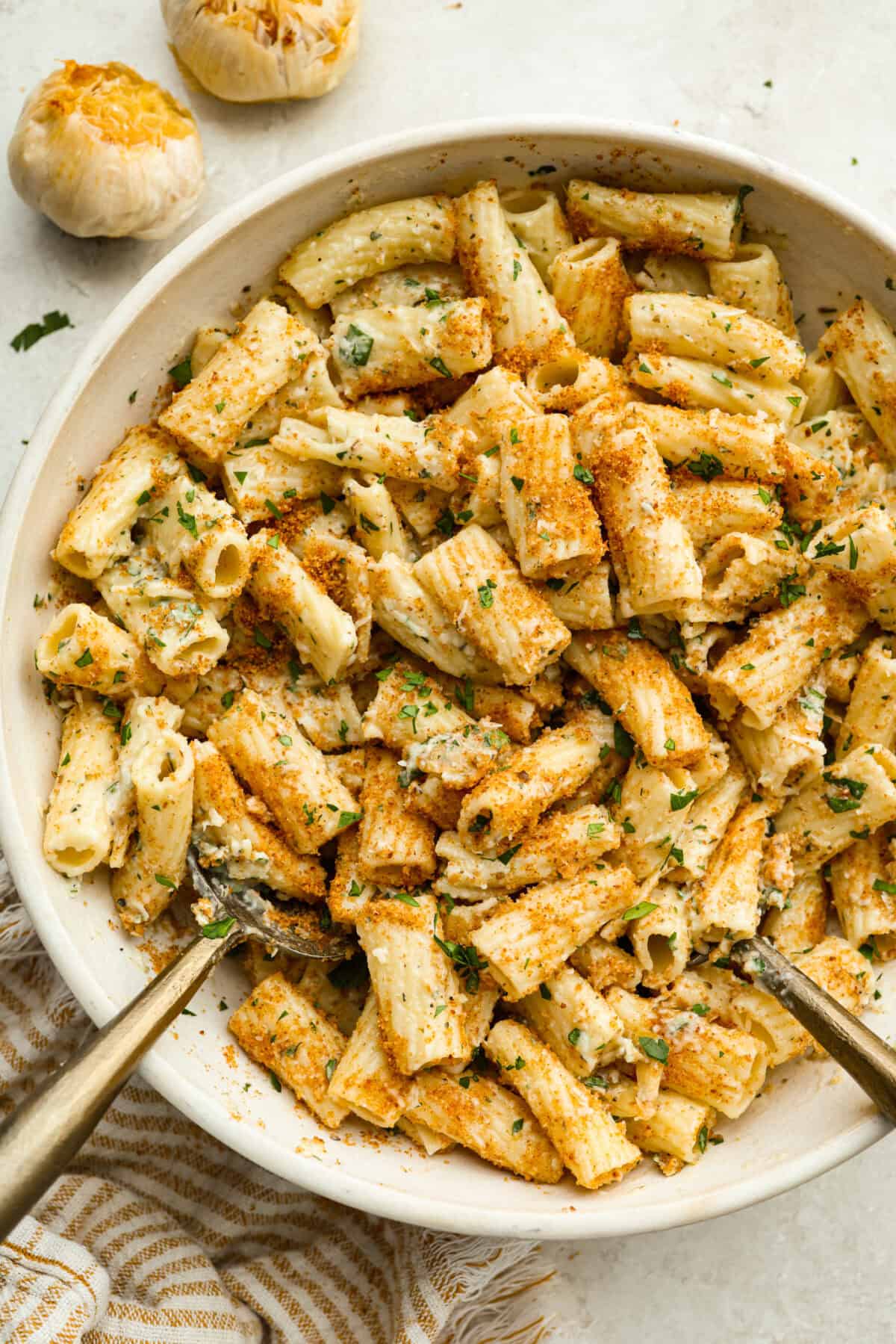 Every time I make garlic bread, my family eats every last piece! This garlic bread pasta has all the same buttery, garlicky flavor you love, just in pasta form. It’s creamy, comforting, and easy to make! And there is plenty to go around! Serving bowl full or garlic bread pasta.