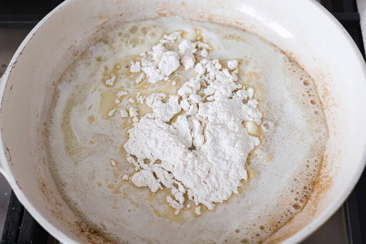 Turn those flavorful pan drippings into the creamiest gravy with a hint of tang. This sour cream gravy is rich, smooth, and so versatile. It's perfect over mashed potatoes, pork chops, but especially on my favorite Swedish Meatballs. Making a roux with butter and flour added to a pan with pan drippings from cooking meat.