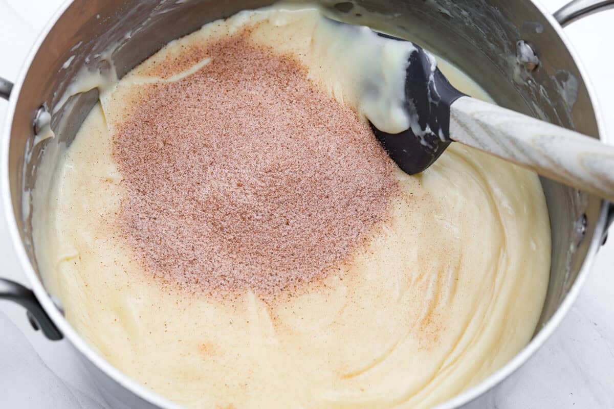 This 4-ingredient churro fudge is pure magic! It's buttery, cinnamon sugary bliss that tastes like a churro and fudge had a baby. Itโs easy to make and even easier to gift (if you can resist eating it all first!). Cinnamon and sugar added to the melted chocolate mixture.