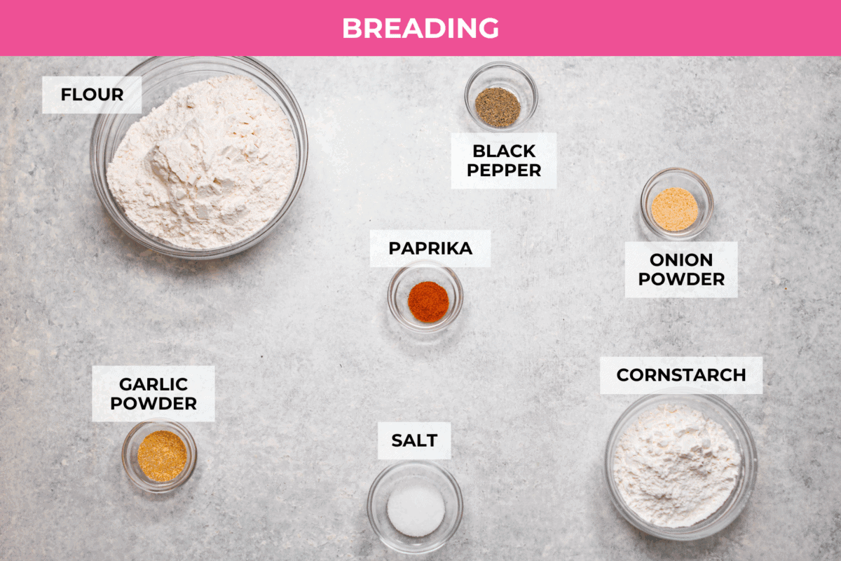 Make this copycat Raising Cane’s chicken tenders at home, no drive-thru required. An easy marinade, simple ingredients, and a quick fry give you crisp, light chicken and that unmistakable Cane’s sauce for a fraction of the cost. Overhead shot of labeled breading ingredients.
