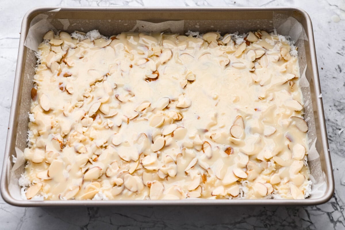 If you love coconut, chocolate, and almonds, these Almond Joy magic bars are the perfect mix. Theyโre gooey in the center, crisp on the edges, and built on a rich chocolate graham crust. Sweetened condensed milk spread over the top of the almond layer.
