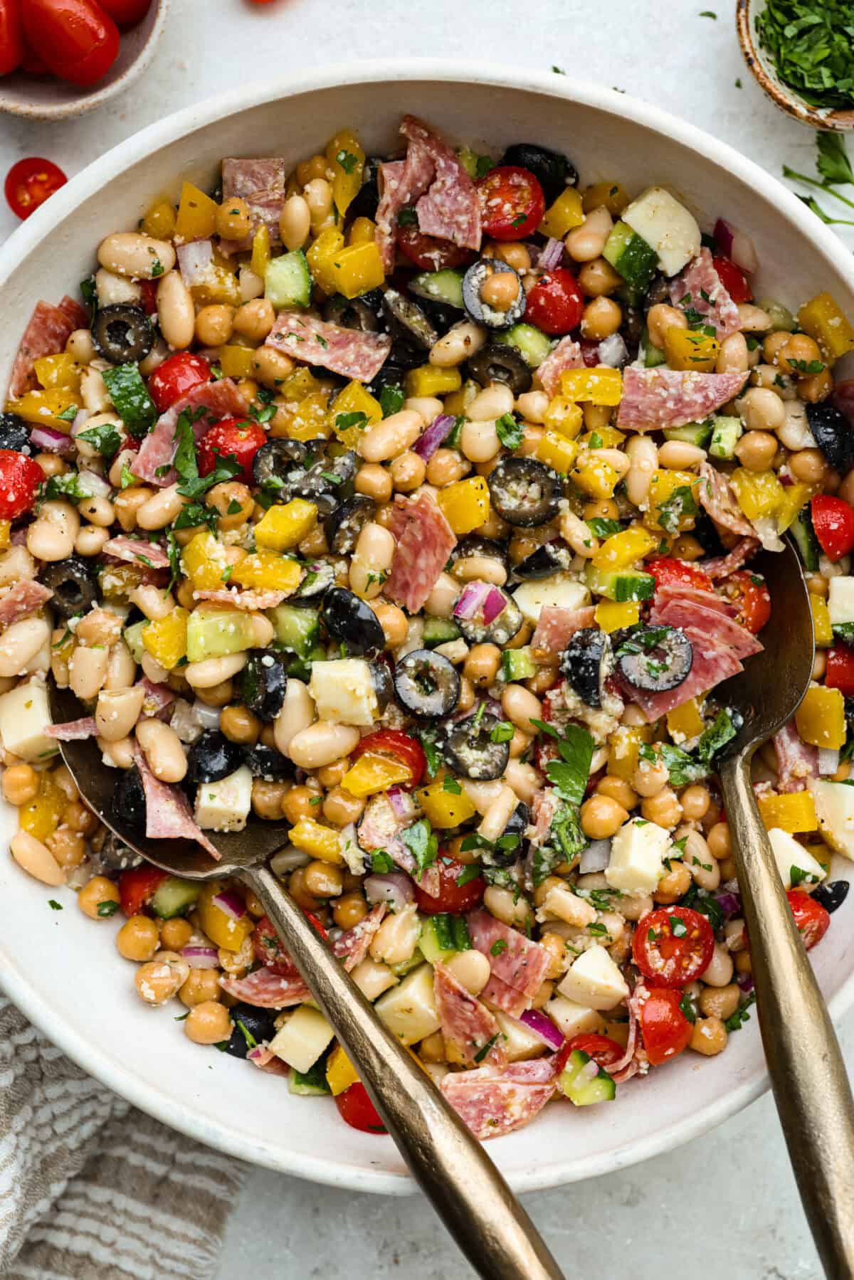 TikTok creator Violet Witchel made this dense bean salad go viral for good reason. Itโs simple, high in fiber, protein-packed, and stays delicious for days. My version keeps the same hearty texture and zesty flavor that made her trend explode. Overhead shot of a bowl of dense bean salad.