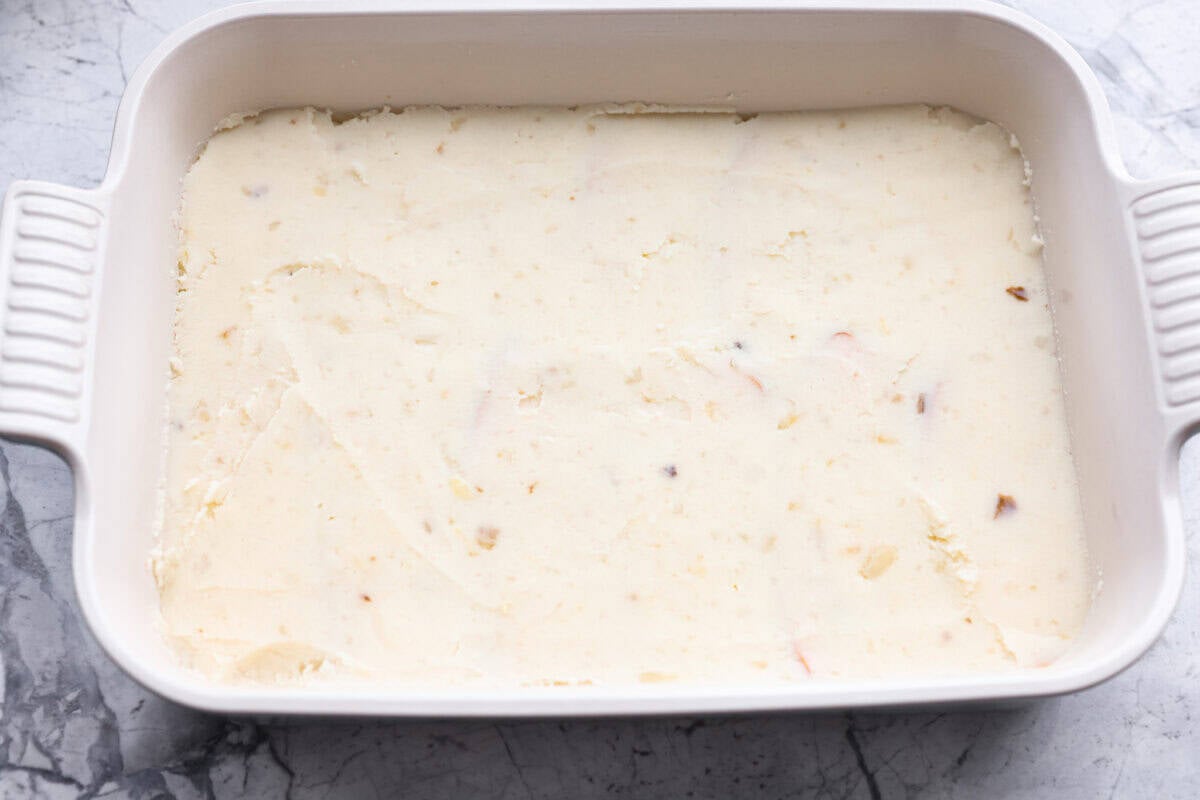 This Thanksgiving leftover casserole is the best way to enjoy every last bit of your holiday meal. I give you tips for keeping it moist, flavorful, and perfectly layered. Mashed potatoes layered over the top of the turkey.