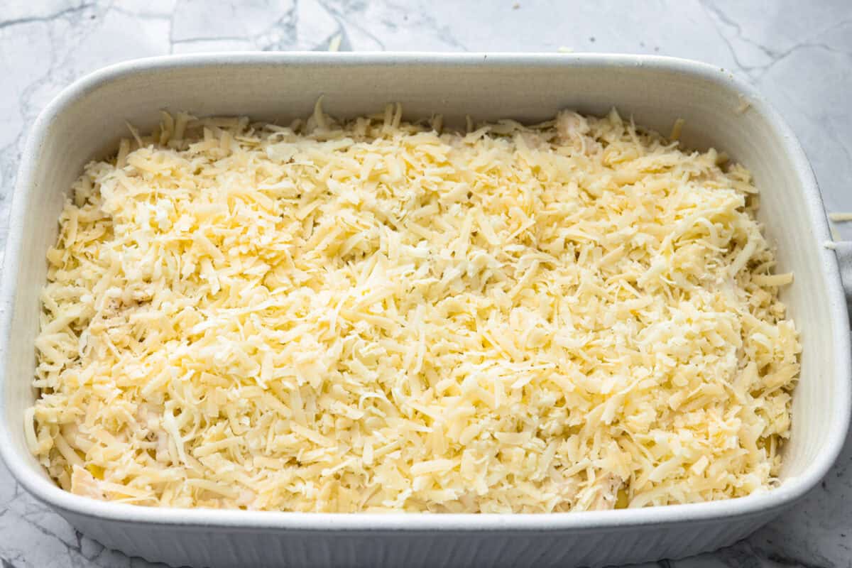 By the end of the day, Iโm wiped and still somehow expected to make dinner. I'm telling you, this Alfredo ravioli casserole will swoop in and save the day! Simply layer, bake, and enjoy! Cheese on top of all of the of the alfredo ravioli casserole.