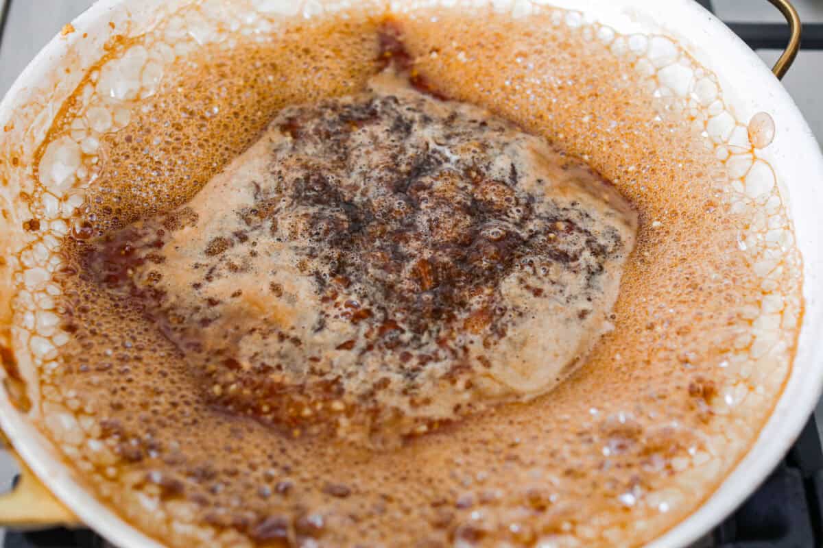 Bourbon shrimp are sticky, garlicky, and packed with flavor. Sweet brown sugar and a splash of bourbon create a quick, glossy glaze that makes this appetizer (or weeknight dinner!) totally irresistible. Marinade on the stove top simmering.