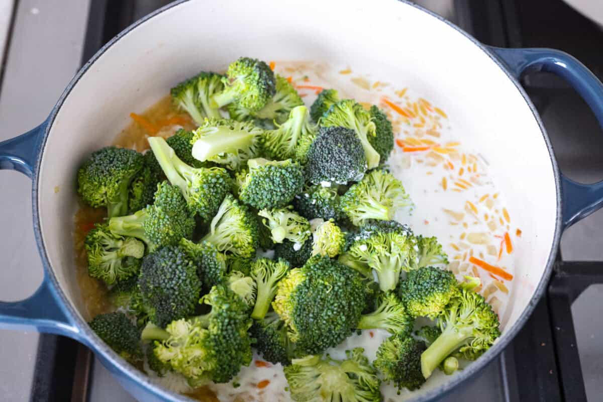 You guys are obsessed with my Broccoli Cheddar soup, and I know you love a good orzo recipe. So this simple, one-pot, ready-in-30-minute Broccoli Cheddar Orzo was born! Broccoli and half and half added to the pot.