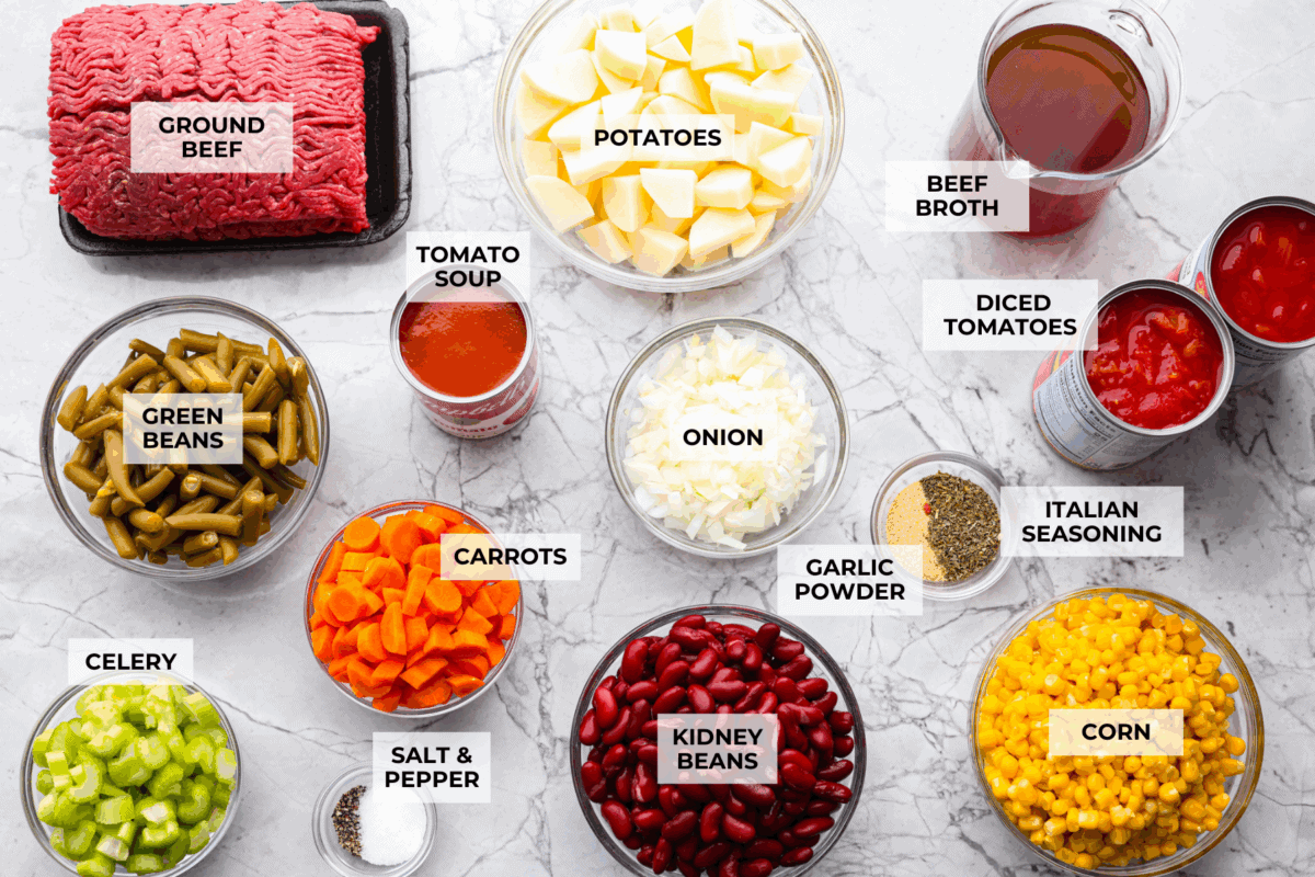 Shipwreck stew is a one-pot dinner that keeps things simple and affordable. Ground beef, tender potatoes, and everyday vegetables cook together in a rich tomato broth. It makes a cozy, filling meal without extra dishes or extra cost. Overhead shot of labeled ingredients.