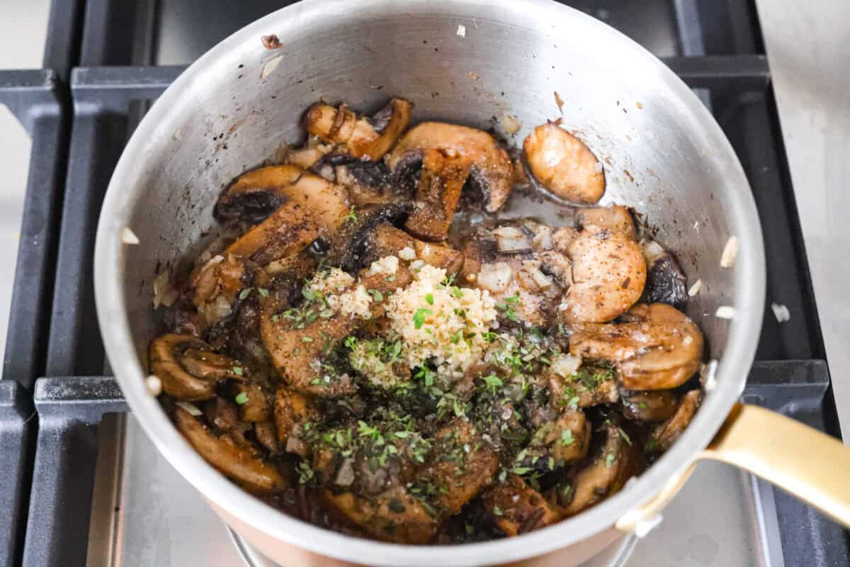 This mushroom rice is way better than a simple side. The secret is a splash of Worcestershire. It enhances the mushrooms and gives the rice this rich, almost buttery flavor. Try it, and you will see exactly what I mean. Mushrooms in a pot cooked down with onions and garlic and fresh thyme added to it.