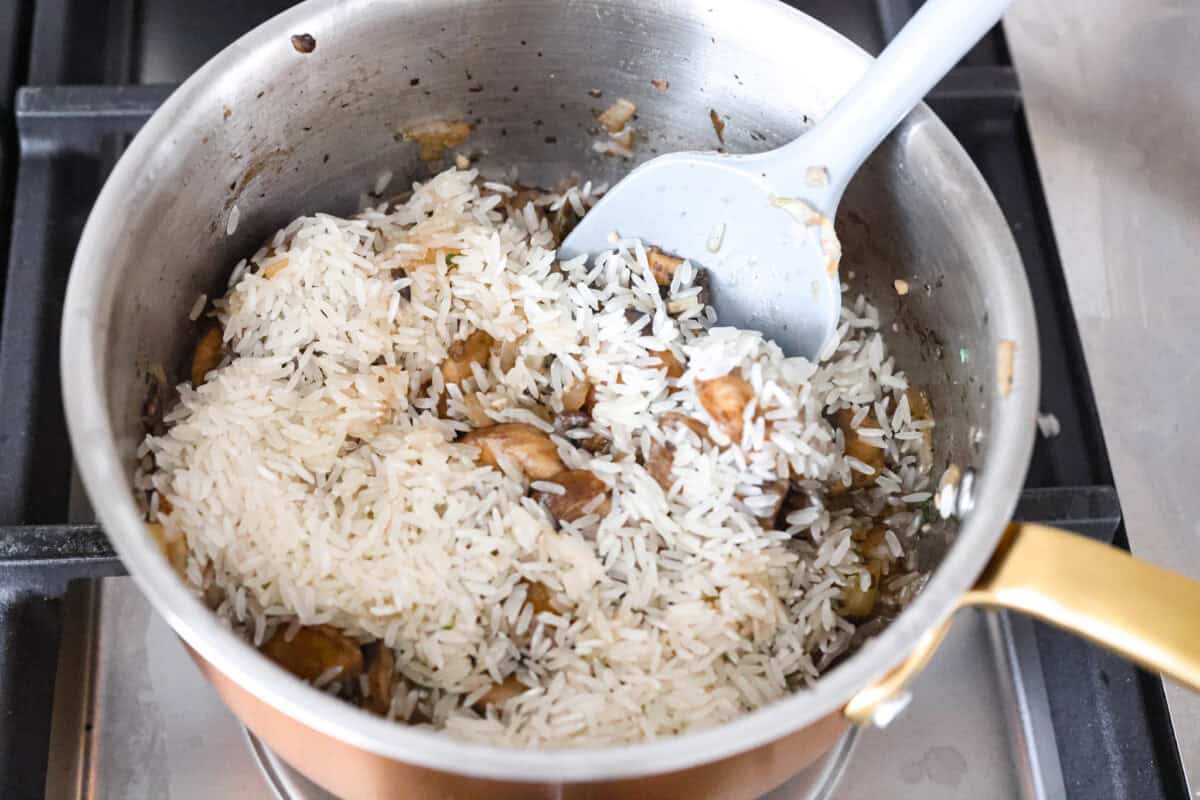 This mushroom rice is way better than a simple side. The secret is a splash of Worcestershire. It enhances the mushrooms and gives the rice this rich, almost buttery flavor. Try it, and you will see exactly what I mean. Rice added to the mushrooms.