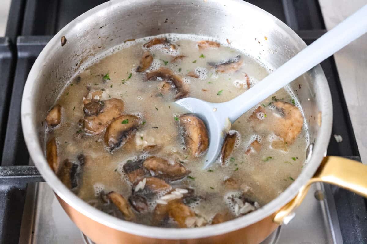 This mushroom rice is way better than a simple side. The secret is a splash of Worcestershire. It enhances the mushrooms and gives the rice this rich, almost buttery flavor. Try it, and you will see exactly what I mean. Broth added and stirred in with the other ingredients.