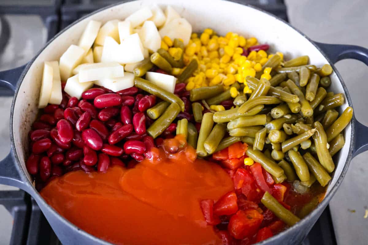 Shipwreck stew is a one-pot dinner that keeps things simple and affordable. Ground beef, tender potatoes, and everyday vegetables cook together in a rich tomato broth. It makes a cozy, filling meal without extra dishes or extra cost. All of the other ingredients added to the pot.