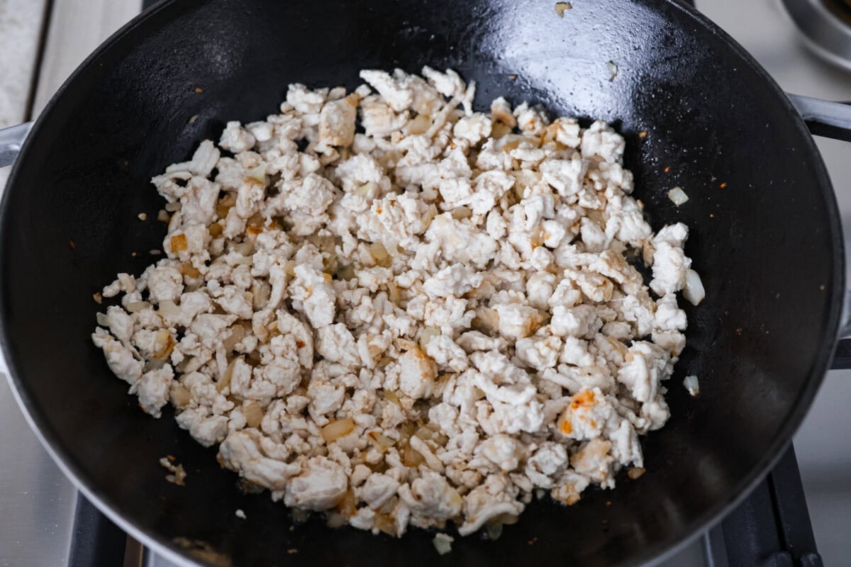 If you havenโt tried egg roll in a bowl yet, youโre in for a treat. Everything you love inside of an egg roll in a lighter, healthier, no-wrapper version! It's ready in 15 minutes, making it a perfect weeknight meal! Ground turkey added to the skillet to brown.