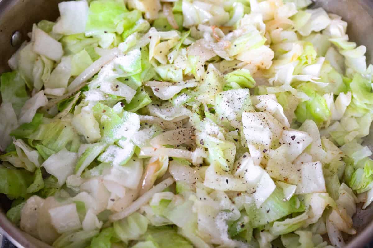 You donโt need fancy ingredients to make something great, and this fried cabbage proves that! Bacon, cabbage, a little seasoning, and a hot skillet. Thatโs it. And it works every single time. Seasonings added to the cabbage cooking in a skillet.