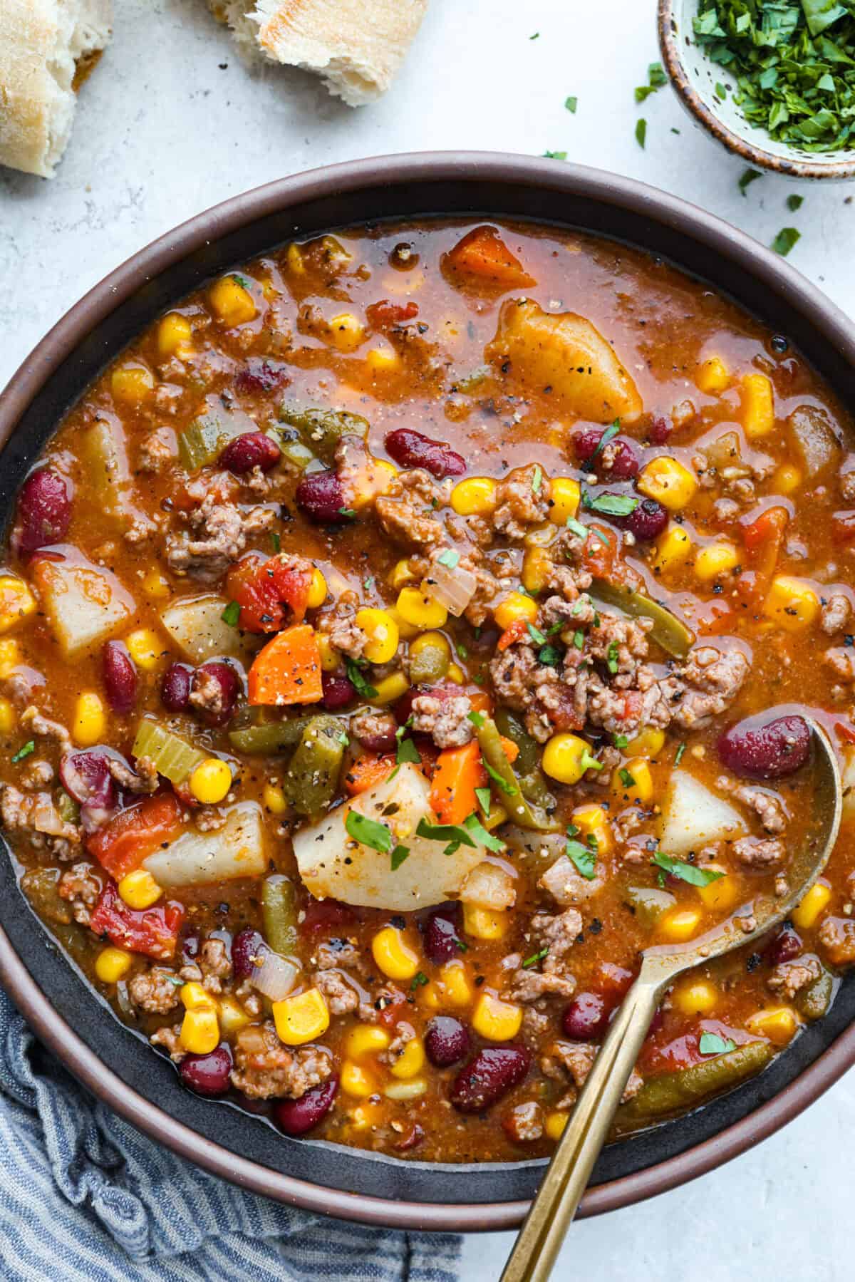 Shipwreck stew is a one-pot dinner that keeps things simple and affordable. Ground beef, tender potatoes, and everyday vegetables cook together in a rich tomato broth. It makes a cozy, filling meal without extra dishes or extra cost. Bowl of shipwreck stew.