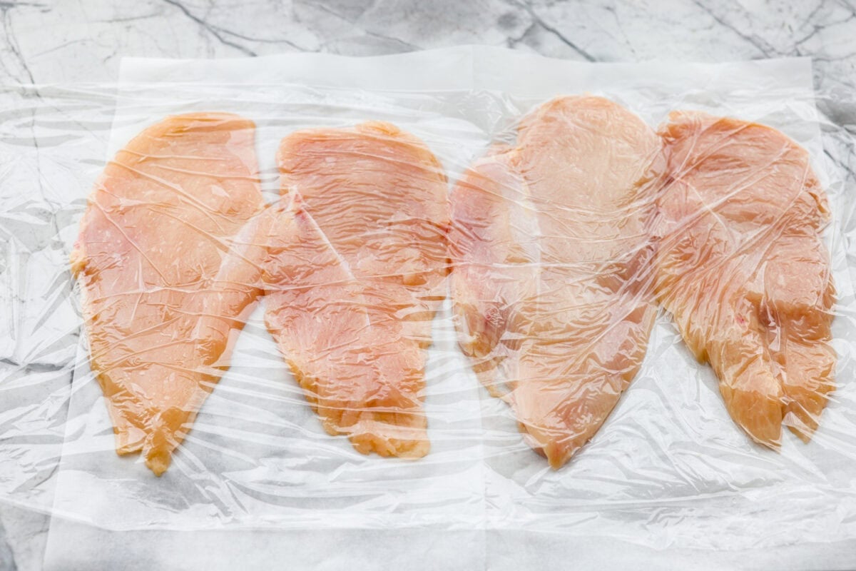 Chicken schnitzel will win you over at first crunch! Thin-pounded, perfectly seasoned chicken is fried to a golden crisp. It’s a timeless, flavor-packed dish that will have your whole family coming back for seconds. Chicken breasts cut in half and placed between plastic wrap and smashed with a meat mallet.
