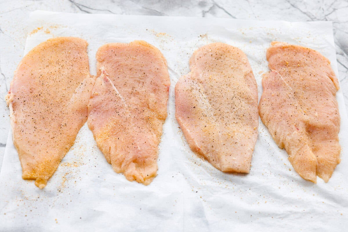 Chicken schnitzel will win you over at first crunch! Thin-pounded, perfectly seasoned chicken is fried to a golden crisp. It’s a timeless, flavor-packed dish that will have your whole family coming back for seconds. Flattened chicken breasts seasoned.
