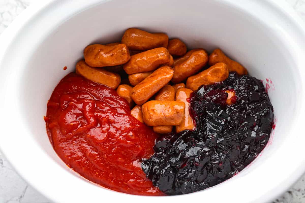 If youโre hosting anything and need a quick appetizer, these crockpot grape jelly little smokies are it. Dump everything in the slow cooker, walk away, and come back to glossy, flavorful sausages that people hover around all night. All of the ingredients added to a crockpot.