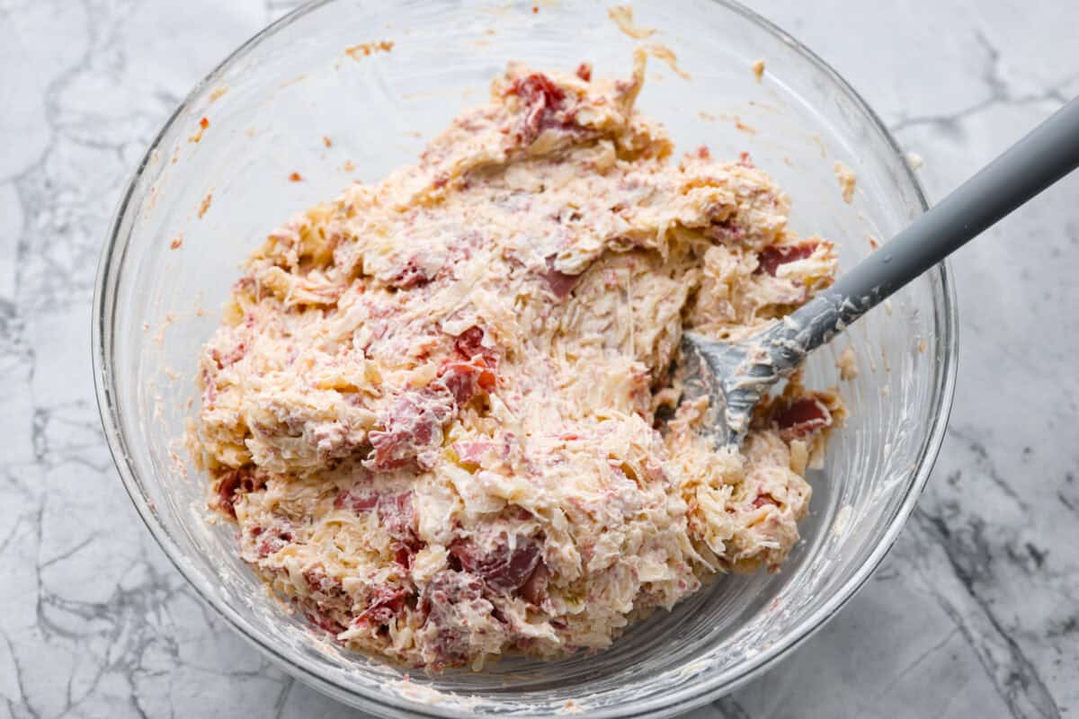 Think of this hot Reuben dip as a love letter to the classic Reuben sandwich. Itโs rich, tangy, loaded with corned beef and sauerkraut, and the perfect way to turn St. Patrickโs Day leftovers into something everyone fights over. All of the ingredients combined.