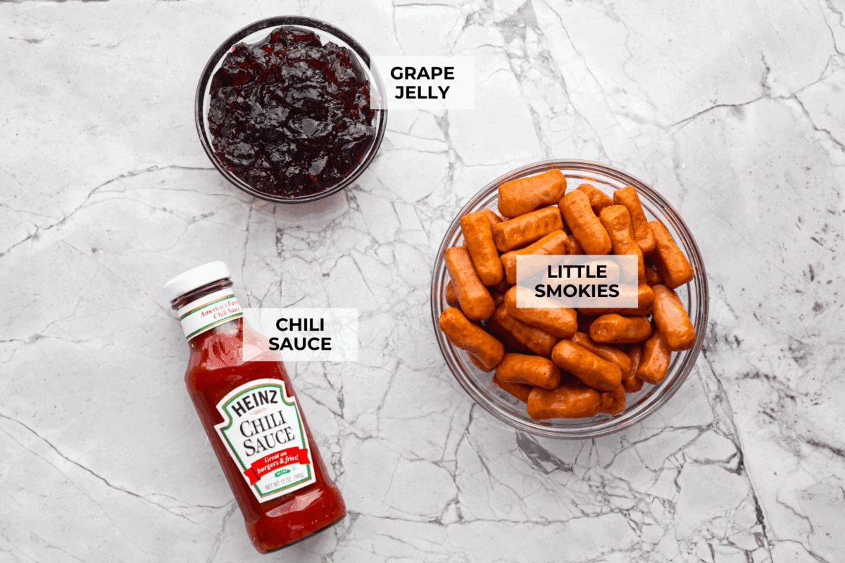 If youโre hosting anything and need a quick appetizer, these crockpot grape jelly little smokies are it. Dump everything in the slow cooker, walk away, and come back to glossy, flavorful sausages that people hover around all night. Overhead shot of labeled crockpot grape jelly little smokies.