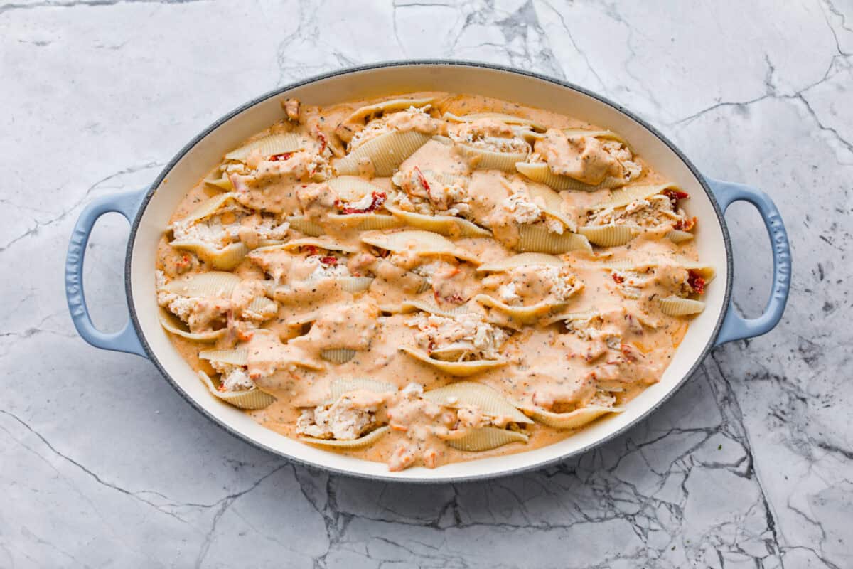 Marry me stuffed shellsย take the viral sauce you love and turn it into a cozy, baked pasta moment. Think creamy chicken-stuffed shells, melty cheese, and just enough sun-dried tomatoes for that extra swoon-worthy touch. The rest of the sauce adde to the top of the shells.