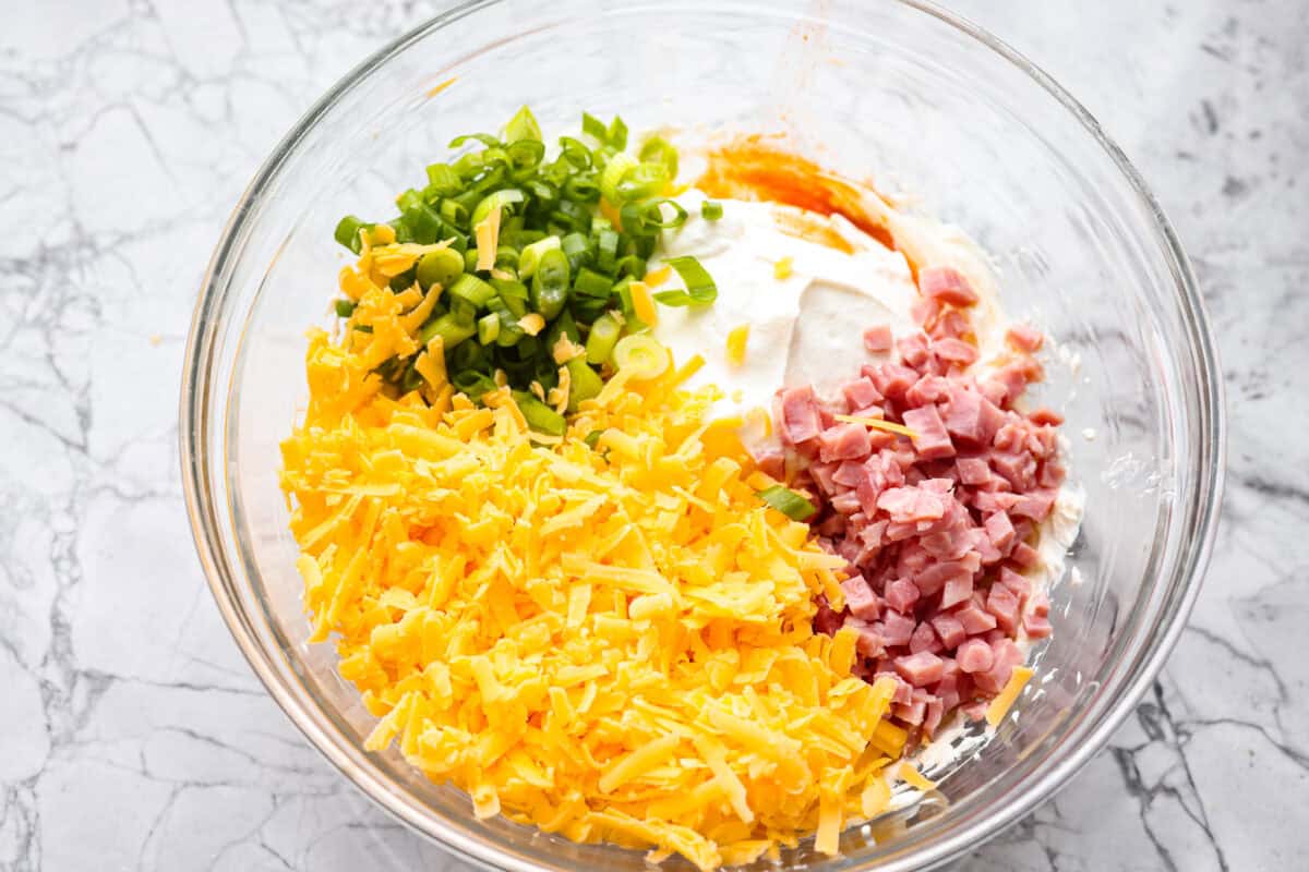 This Mississippi sin dip is pure comfort-food goodness. Creamy, cheesy, a little smoky, and baked into a loaf of French bread, itโs the kind of snack everyone gathers around and keeps going back for! Dip ingredients all added to the softened and whipped cream cheese.