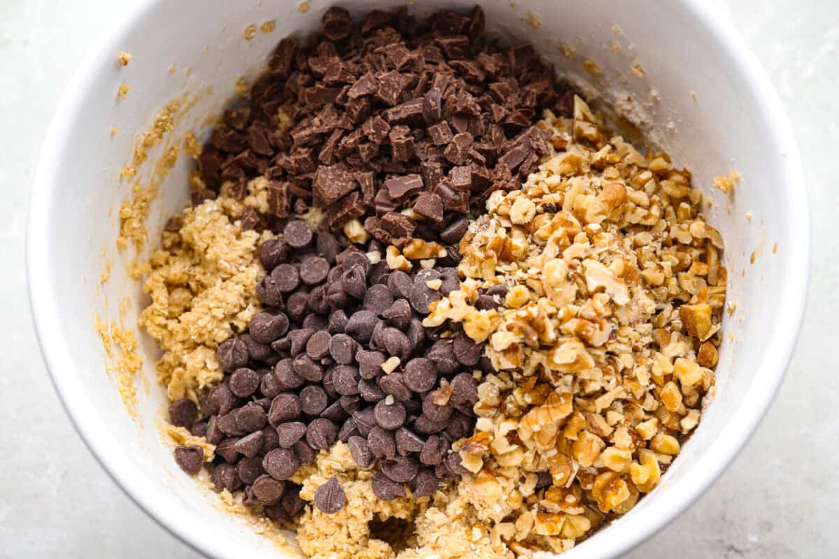 These Neiman Marcus Chocolate Chip Cookies come with a famous backstory, but the real star is the cookie itself. Thick, chewy, and packed with oats, two kinds of chocolate, and crunchy walnuts, theyโre truly worth the hype. Chocolate chips, chocolate bar pieces, and chopped walnuts added to the cookie dough.