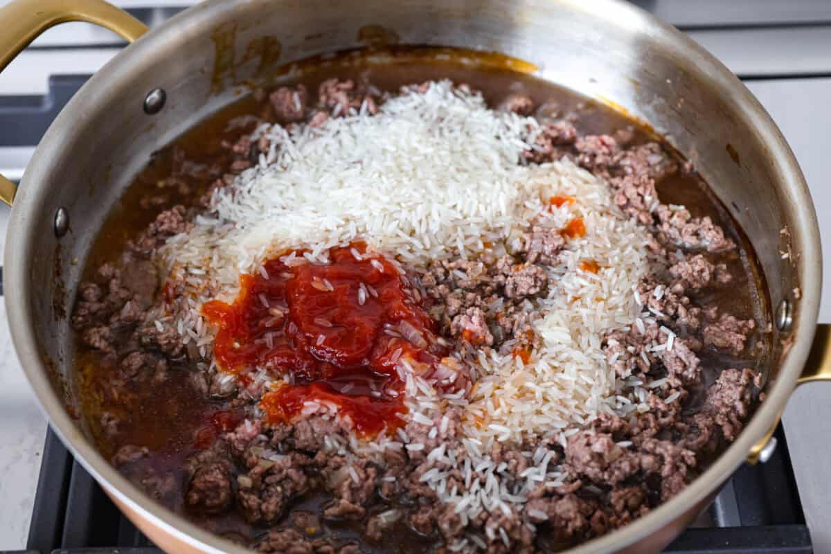Cheeseburger rice is everything you love about a juicy cheeseburger, made easy in one skillet. Hearty, cheesy, and packed with flavor, itโs the ultimate weeknight comfort meal. Rice, ketchup and other ingredients added to the ground beef.