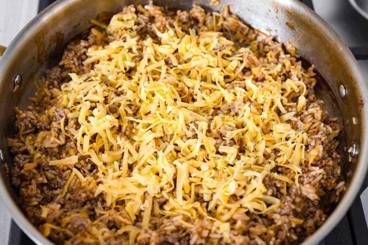 Cheeseburger rice is everything you love about a juicy cheeseburger, made easy in one skillet. Hearty, cheesy, and packed with flavor, itโs the ultimate weeknight comfort meal. Cheese added to the cheeseburger rice.