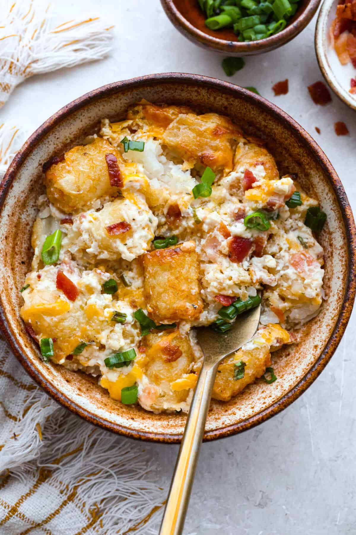 Crack tater tot casserole is bold, cozy, and a little bit addictive, in the best way! Creamy, cheesy, and topped with crispy tots, it’s the kind of dinner everyone gets excited about. Serving portion of cracked out tater tot casserole.