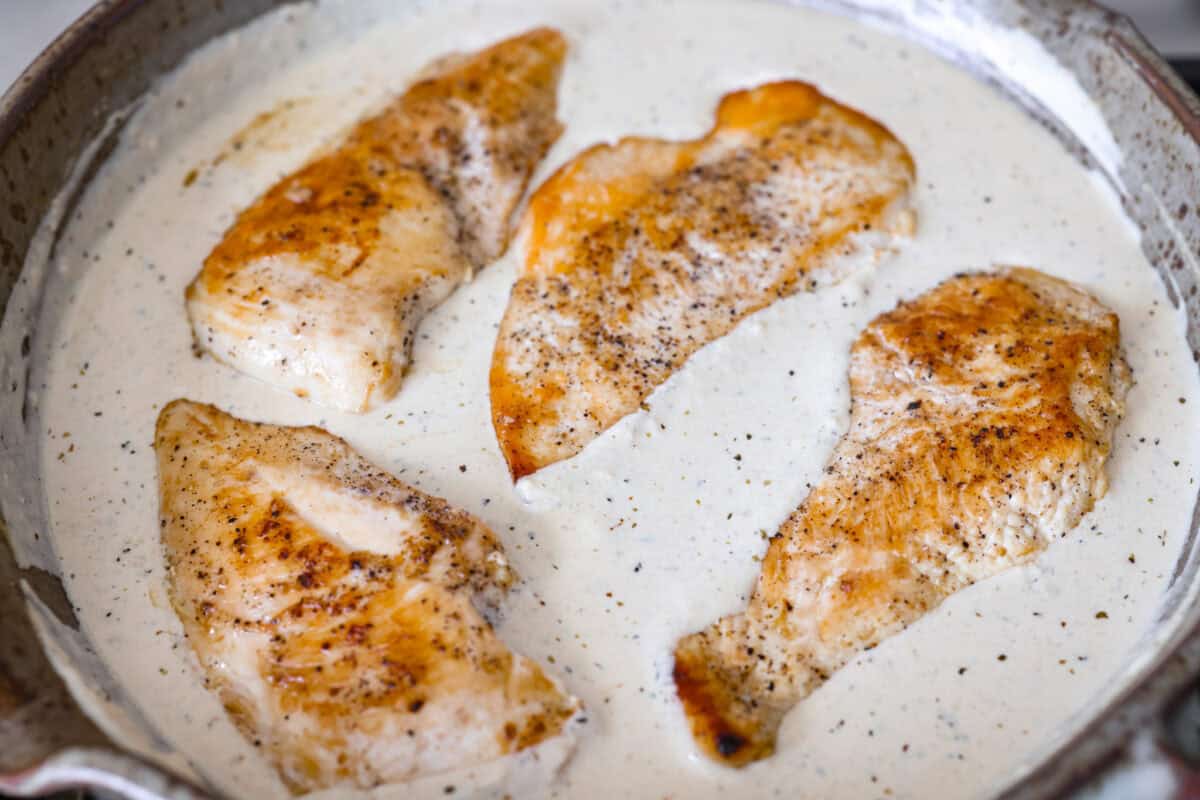 I'm excited for you guys to try this cream cheese chicken. It's an easy one-pan dinner with a rich, creamy sauce that delivers pure comfort food vibes. Itโs quick to make, easy to clean up, and perfect for cozying up on a busy night. Cooked chicken added to the sauce.