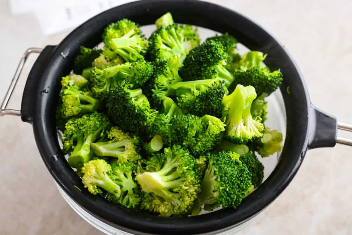Chicken Divan is what I make when I want comfort food that still feels a little put-together. You get tender chicken, crisp-tender broccoli, and a creamy sauce bubbling under the most delicious golden, crunchy topping! Broccoli being steamed.