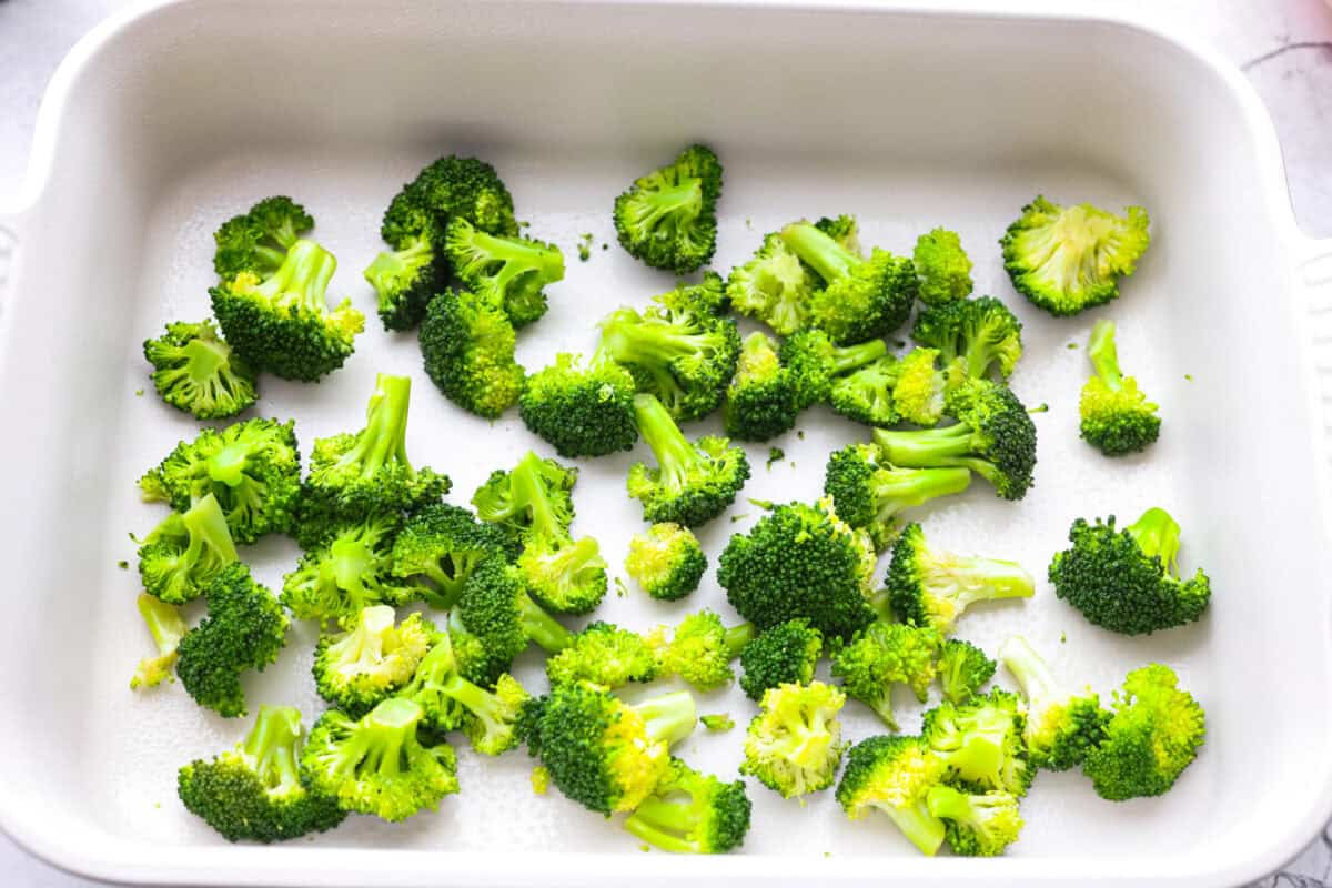 Chicken Divan is what I make when I want comfort food that still feels a little put-together. You get tender chicken, crisp-tender broccoli, and a creamy sauce bubbling under the most delicious golden, crunchy topping! Steamed broccoli spread out in the bottom of the casserole dish.