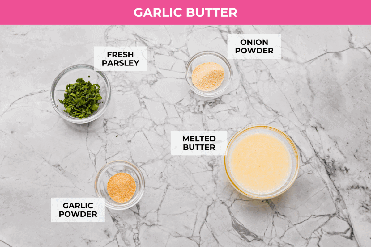 If you love my Red Lobster Biscuits, this Cheddar Bay Biscuit Bread has the same buttery, garlicky cheddar flavor, just mixed and baked right in a bread pan. Slice it warm and serve it with basically anything. It's a must-make! Trust me! Overhead shot of labeled garlic butter sauce ingredients.
