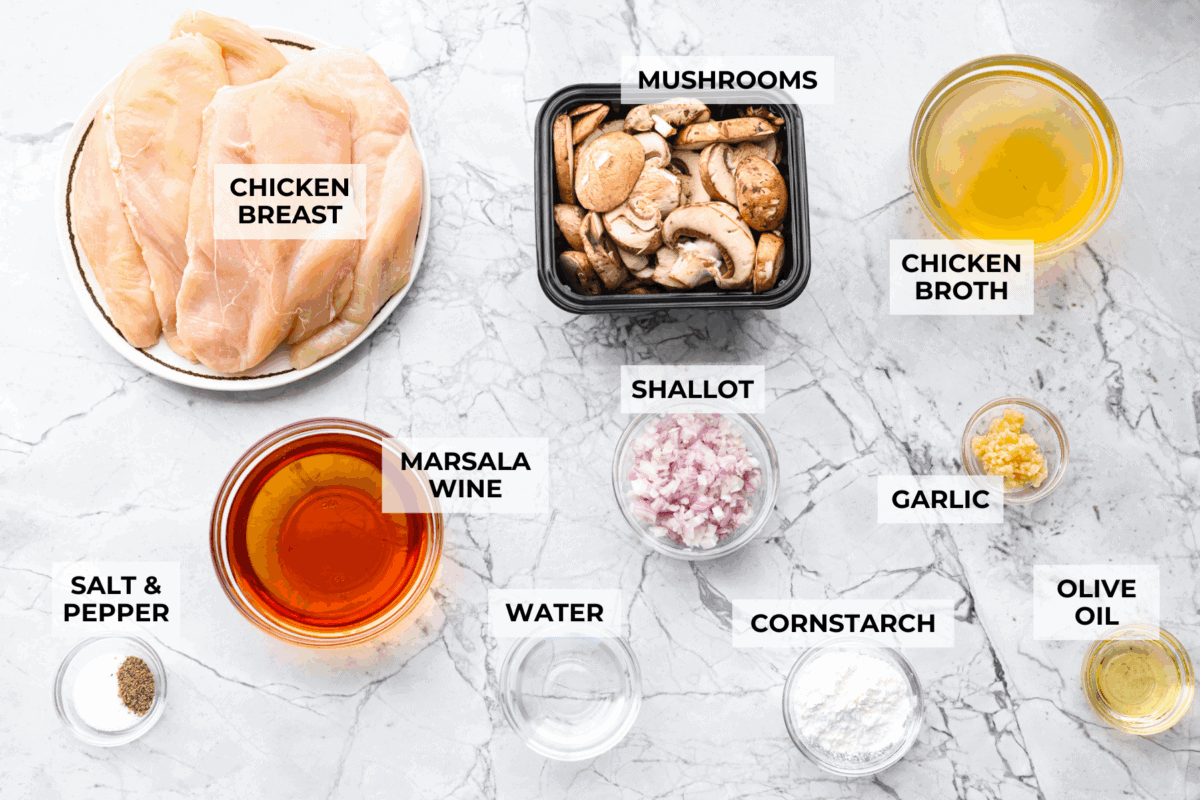 This crockpot chicken marsala brings restaurant-style flavor straight to your slow cooker. Tender chicken, mushrooms, and a rich marsala sauce come together for an effortless dinner youโll want on repeat. Overhead shot of labeled crockpot chicken marsala ingredients.
