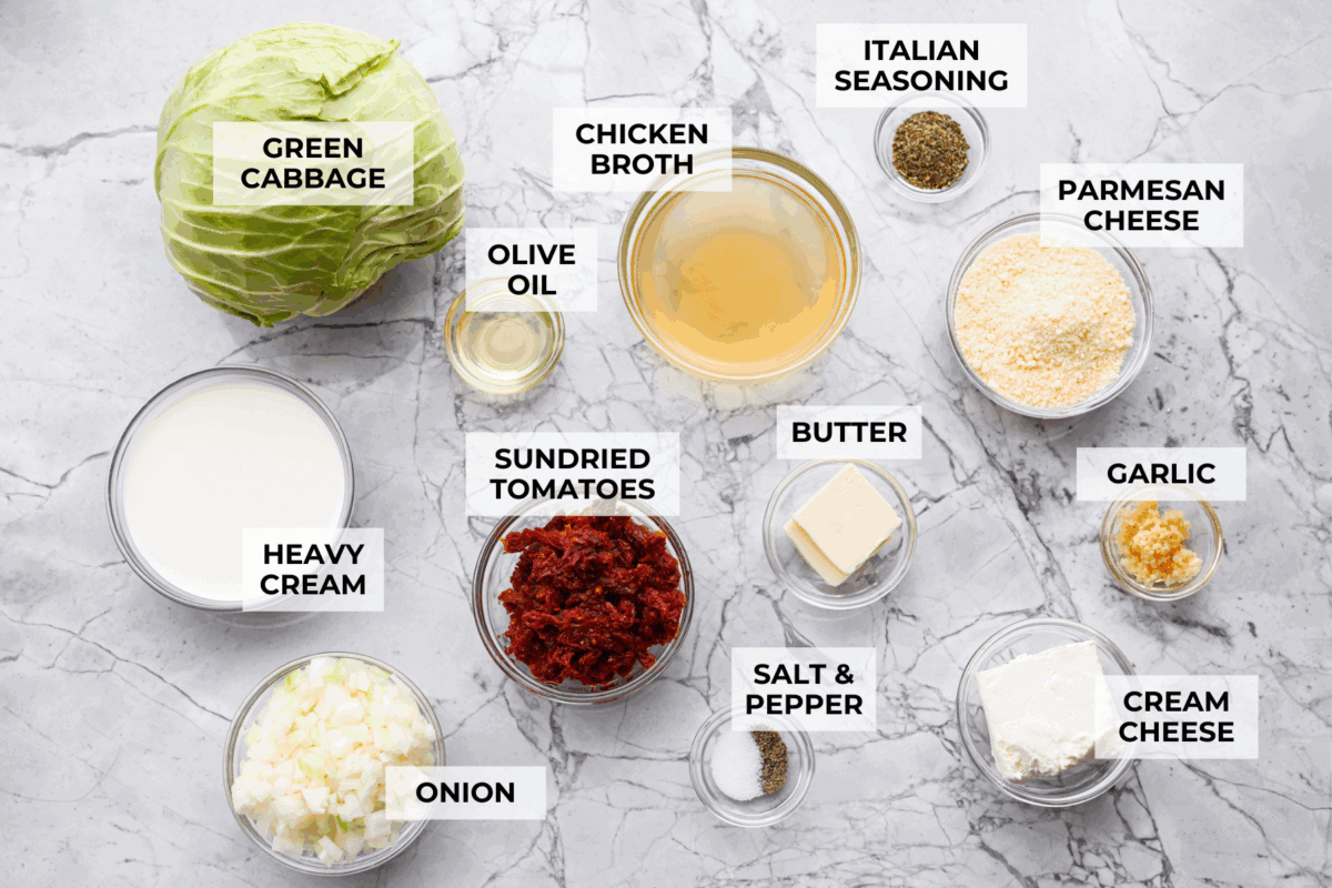 Groceries are expensive right now, so Iโve been leaning hard on the cheap staples. This melting cabbage with a garlicky cream sauce, sun-dried tomatoes, and Parmesan is easy, budget friendly, and tastes amazing. Overhead shot of labeled ingredients.
