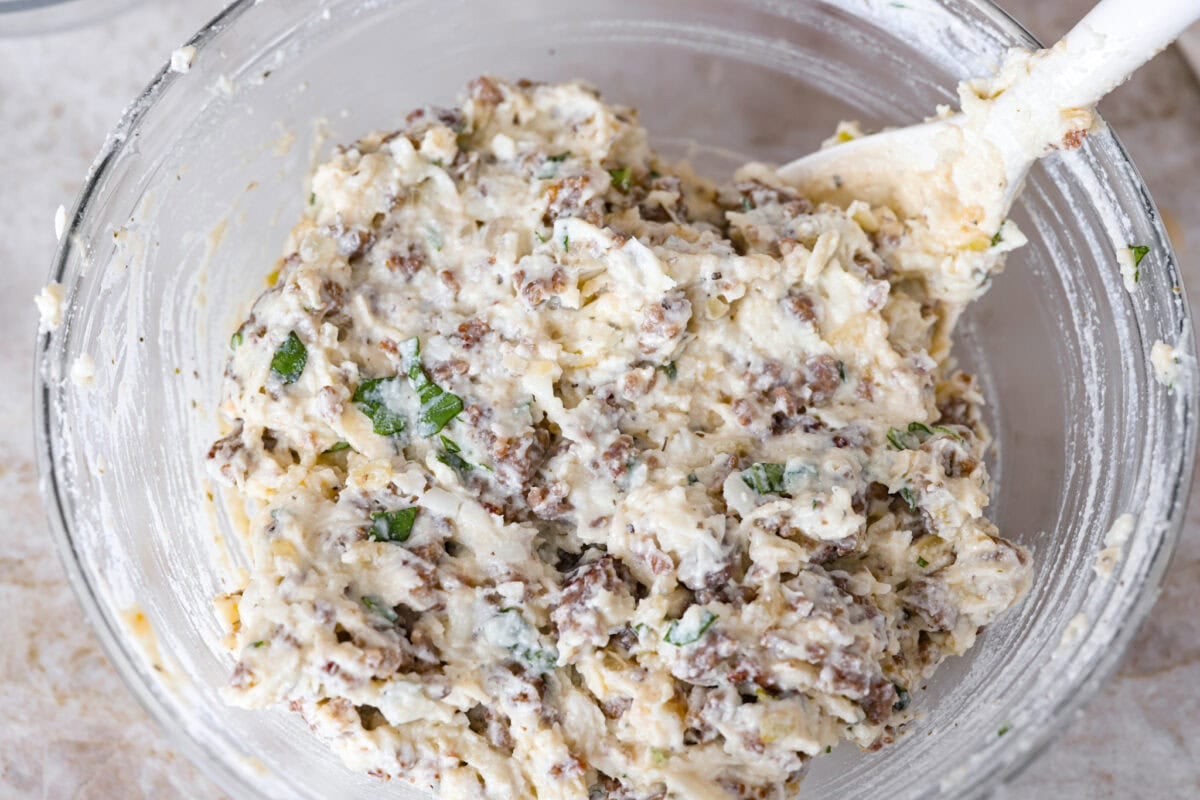 My classic manicotti is a reader favorite, so I wanted to make a version with a little more protein. Sausage is one of my favorite pasta add-ins, and it keeps this new Sausage Manicotti budget-friendly, hearty, cheesy, and so satisfying. Sausage and ricotta cheese mixed together.