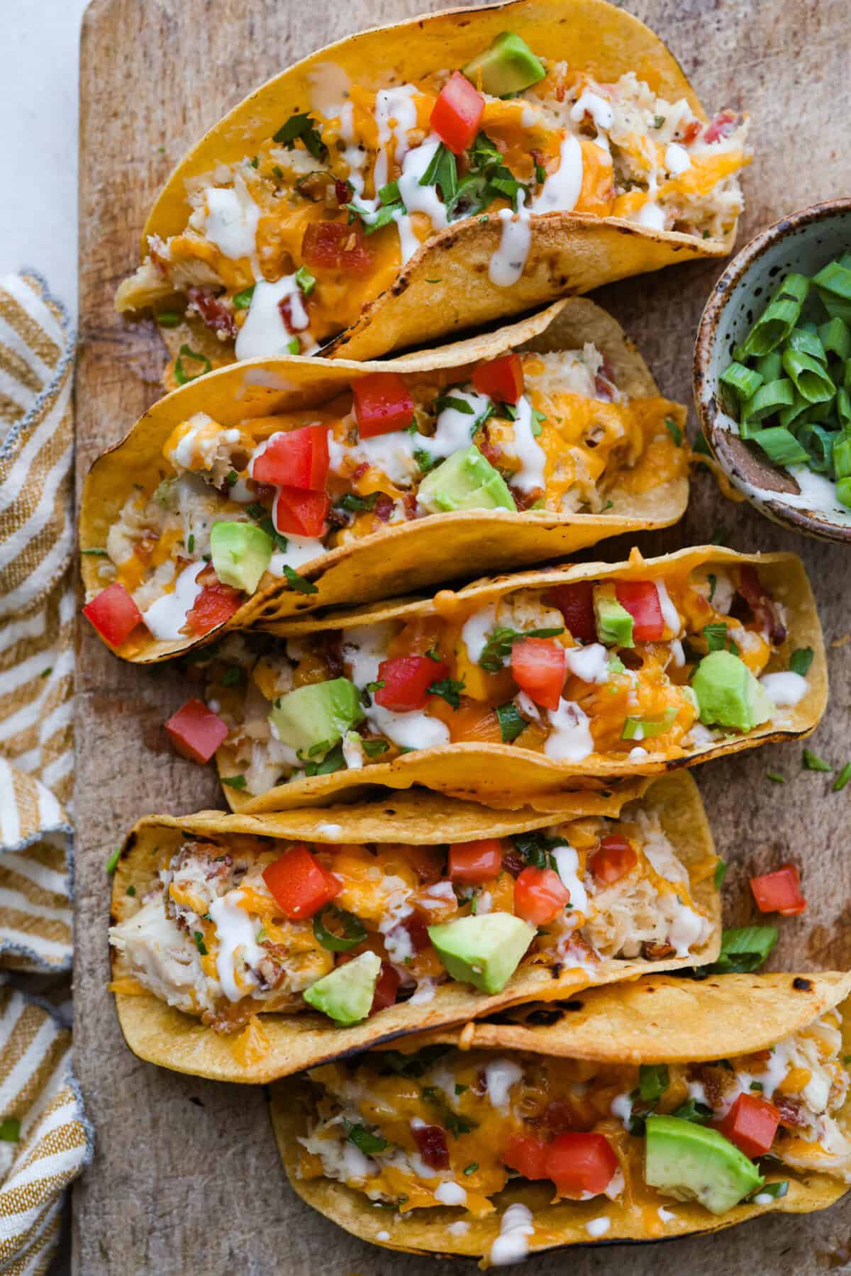 Get ready to be instantly obsessed with these crack chicken tacos! They are loaded with creamy ranch chicken, crispy bacon, and melty cheddar for a can’t-stop-eating dinner that disappears fast. Overhead shot of crack chicken tacos ready to be eaten!
